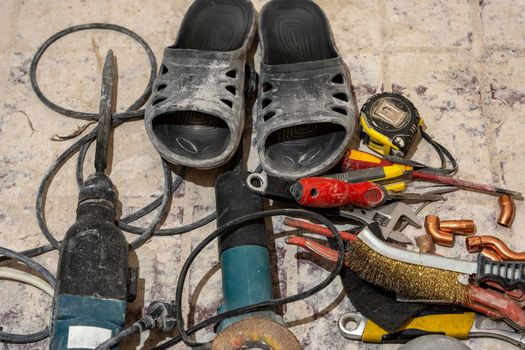 a working tool for apartment renovation. A puncher, a grinder and a tape measure. High quality photo