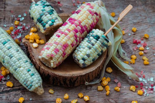 Fresh waxy corn or Sweet glutinous corn and Corn kernelson Rustic old wooden background. Tropical whole grain food, Selective focus.