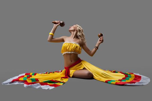 Studio portrait of sexy dancer in mexican costume