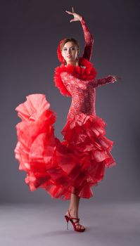 one woman dance flamenco in red costume