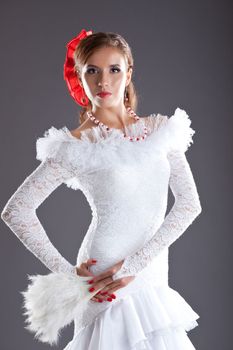 young woman flamenco dancer studio portrait in white oriental costume