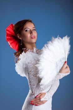 Young woman dance in white oriental flamenco costume