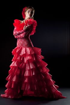 Full length portrait of flamenco dancer in red costume