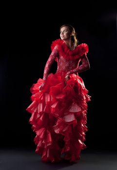 Full length portrait of flamenco dancer in red costume