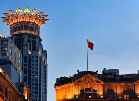 shanghai at evening, buildings with light and flag