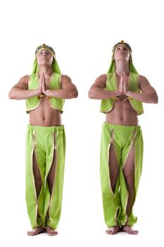 Two athletic man posing in arabian costume dancers isolated