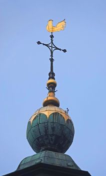 A golden weathercock on the roof of the Walburga church in Zutphen, the Netherlands