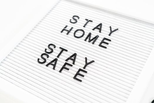 STAY HOME and STAY SAFE sign on message board.