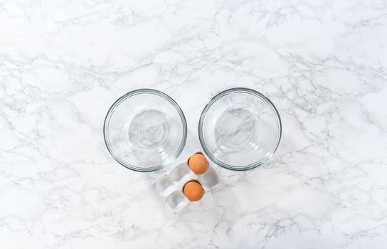 Separating egg whites and yolks to bake Easter meringue cookies.