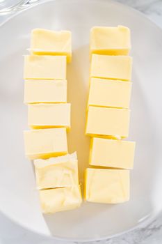 Ingredients in glass mixing bowls to prepare lemon bundt cake.
