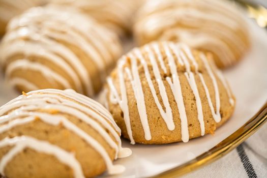 Freshly baked chocolate cookies with eggnog scones with a white chocolate drizzle on top.