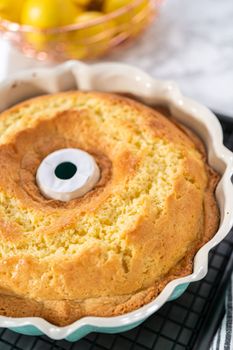 Freshly baked lemon bundt cake in a bundt cake pan.