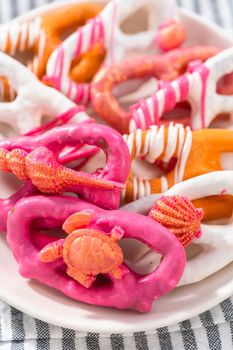Gourmet chocolate-covered pretzel twists with seashell-shaped chocolates.