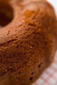 Cooling freshly baked eggnog bundt cake on a kitchen counter.