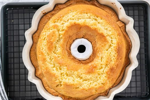 Freshly baked lemon bundt cake in a bundt cake pan.