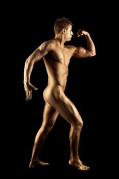 Nude man show athletic body with metal skin statue