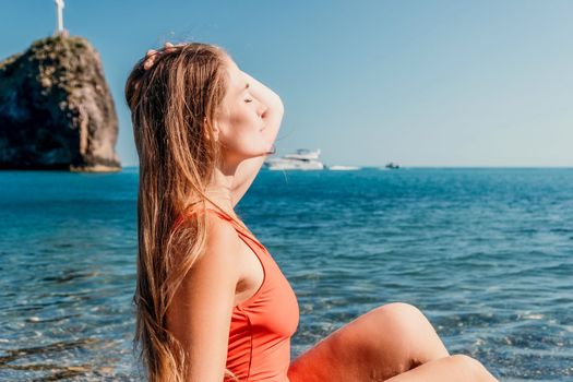 Sexy young woman in stylish bikini lying on seashore, closeup. Holiday, vacation and recreational concept.