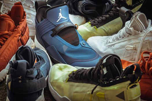 Bangkok, Thailand - Dec 17, 2022 - Detailed view of Nike Air Jordan series basketball shoes collection was placed on lawn. Set of sneakers by Air Jordan brand "Jumpman", Selective focus.