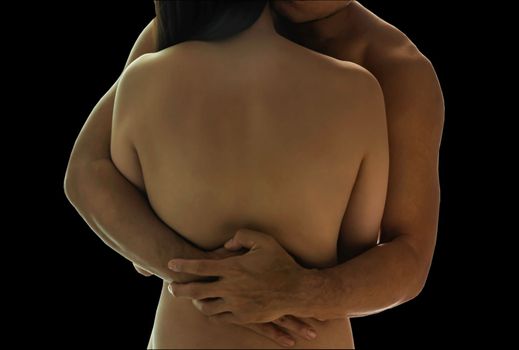 Conceptual of Young naked couple are embrace to each other together isolated on black background with clipping path for easy in your design concept of Hug, Care, Support and Love. Focus and blur.