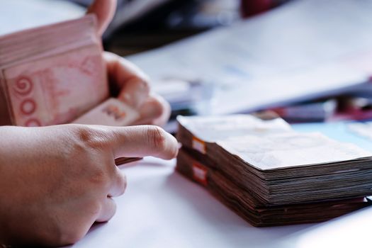 close up image of female hand count the money, business accounting background