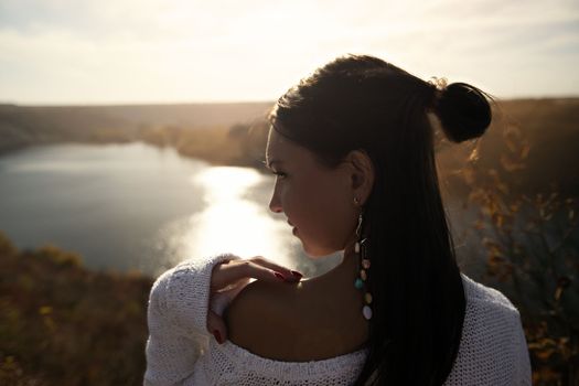 Fashion Gir. Beautiful fashionable glamor girl shows poses in modern clothes against the backdrop of beautiful scenery and flawless nature. creative photo. High quality photo