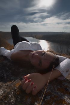 Fashion Gir. Beautiful fashionable glamor girl shows poses in modern clothes against the backdrop of beautiful scenery and flawless nature. creative photo. High quality photo