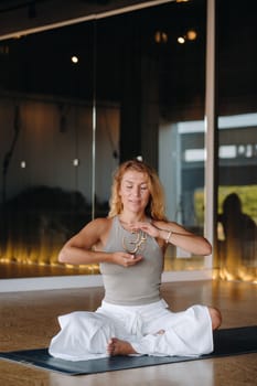 The girl does yoga and is in a state of meditation. The concept of a healthy lifestyle.