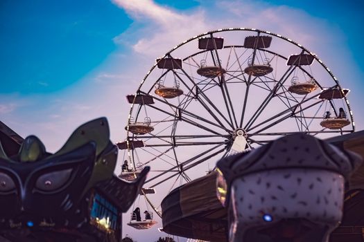 Rovigo, Italy 25 October 2022: Funfair ferris wheel at sunset