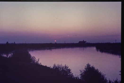 Rovigo, Italy october 1976: Po valley natural landscape at sunset in 70s