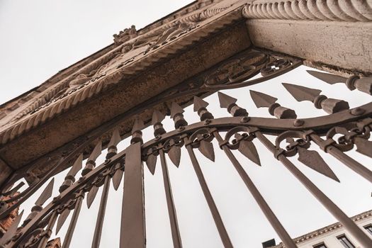 Ancient iron gate in a historical building detail