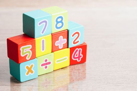 Number wood block cubes for learning Mathematic, education math concept.