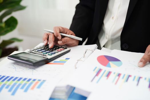 Business woman working and analysis with statistic graph in office. 