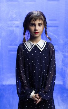 Portrait of a girl in a suit. Holiday. Hallowmas. Wednesday Addams. The Addams Family. Reincarnation. Cosplay. Idea for Halloween.