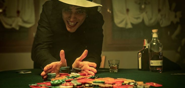 A dramatic moment in a high-stakes poker game as all the chips, or "fiches," are pushed forward, signaling an all-in bet. Representing the high stakes and the potential for a big payout.