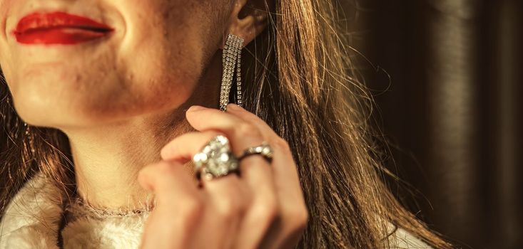 Close up shot of Detail of a trendy earring worn by a beautiful girl