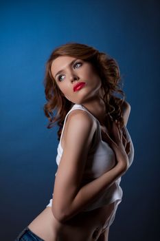 Pretty brunette woman in jeans and white tank top