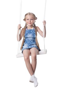Studio portrait of beautiful blonde girl sit on swing. Isolated on white