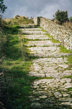 Stone path made of cobble stones in nature. Mountains in Zamora , Spain.