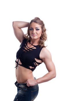 Young woman with perfect strong body posing in fashion cloth isolated