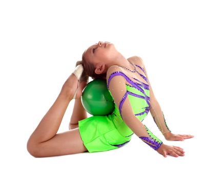 Kid lay with green gymnastic ball isolated