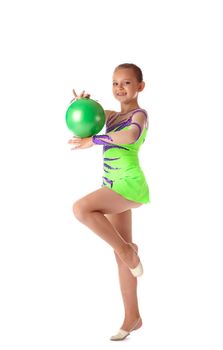 young gymnast girl stand and smile with green ball isolated