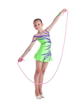 Young kid gymnast posing with skipping rope isolated