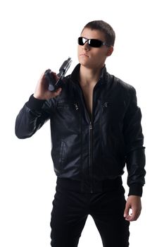 Security officer in black leather with shotgun isolated
