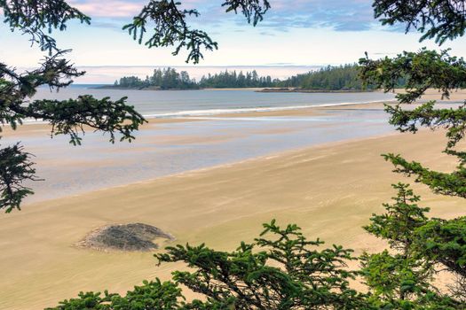 Tidal rise on Pacific ocean long beach near Tofino, British Columbia, Canada.