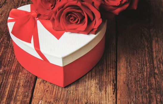 red rose on a wooden background. Valentine's Day gift.selective focus.holiday