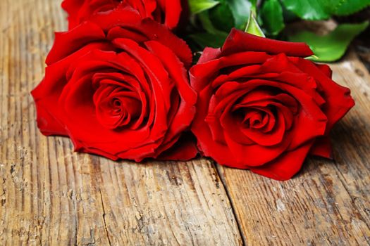 red rose on a wooden background. Valentine's Day gift.selective focus.holiday