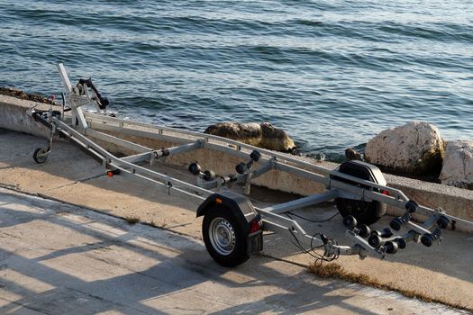 car trailer for transporting boats on the sea pier.