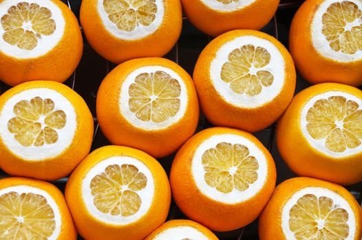 cut fresh oranges for orange food background, top view.