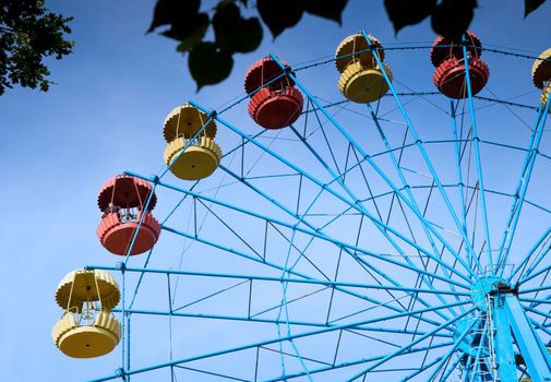 fragment Carousel ferris wheel in summer park