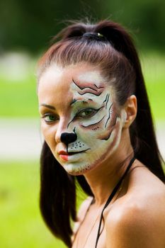 Girl with tigress make up close up portrait